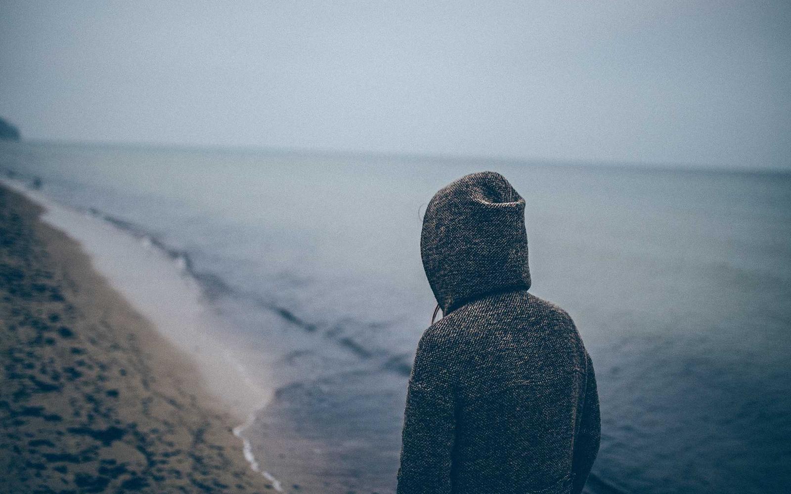 Someone standing at the edge of the sea